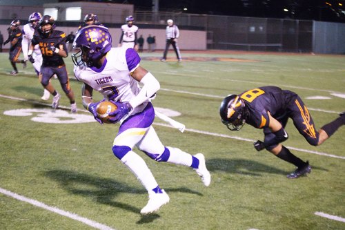 Lemoore's Demel Turner on a long run and touchdown Friday night in the Division II playoff game at McClymonds High School